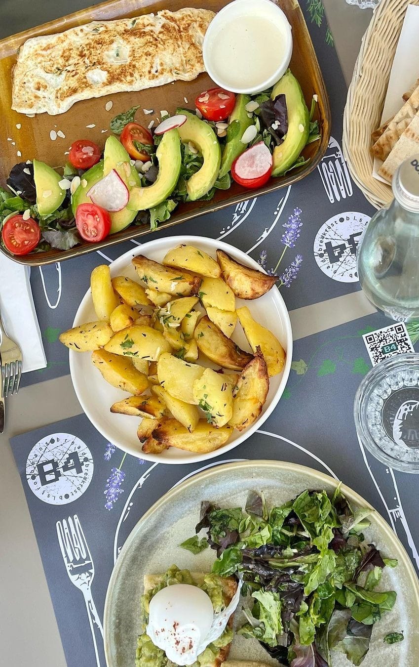 A brunch plate with avocado, radish and roasted potatoes